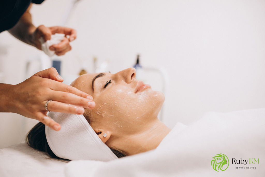 Woman receiving a professional facial treatment at a beauty center
