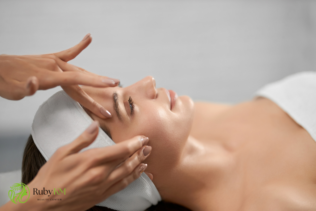 Lymphatic facial massage with gentle hand movements on the face