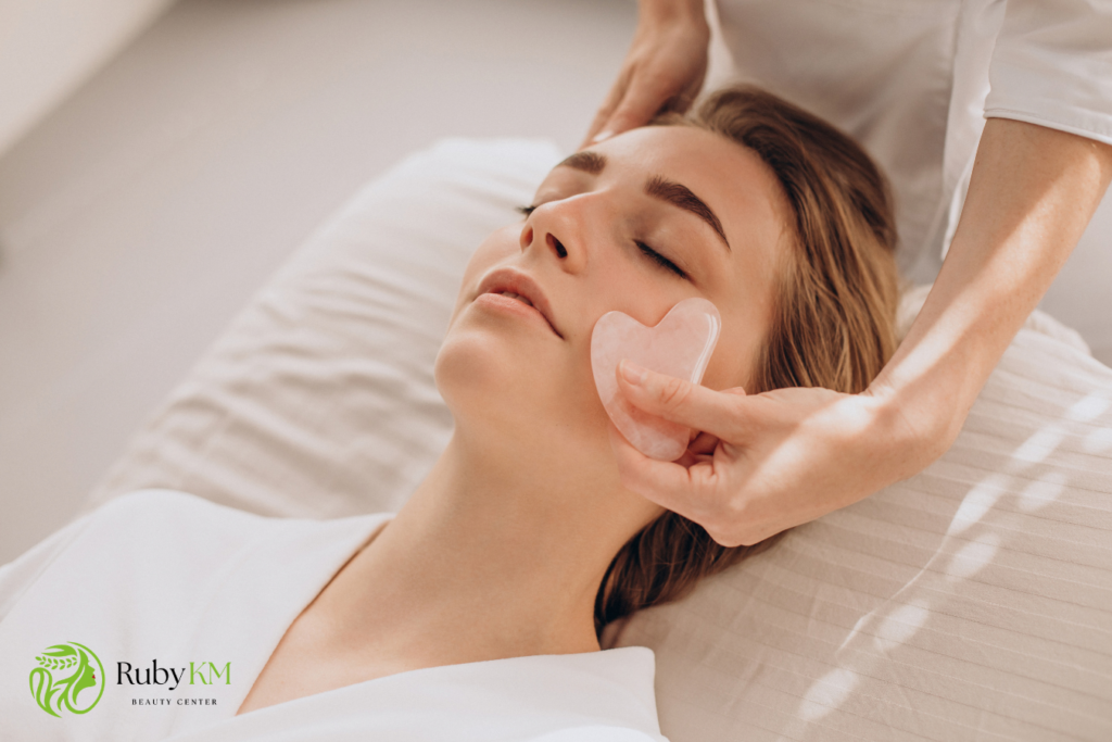 Gua sha facial massage using a heart-shaped gua sha tool