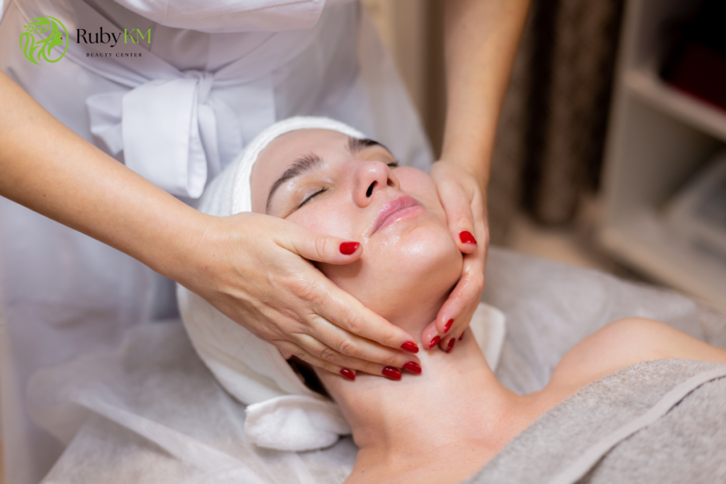 Woman receiving a professional facial massage at a beauty center